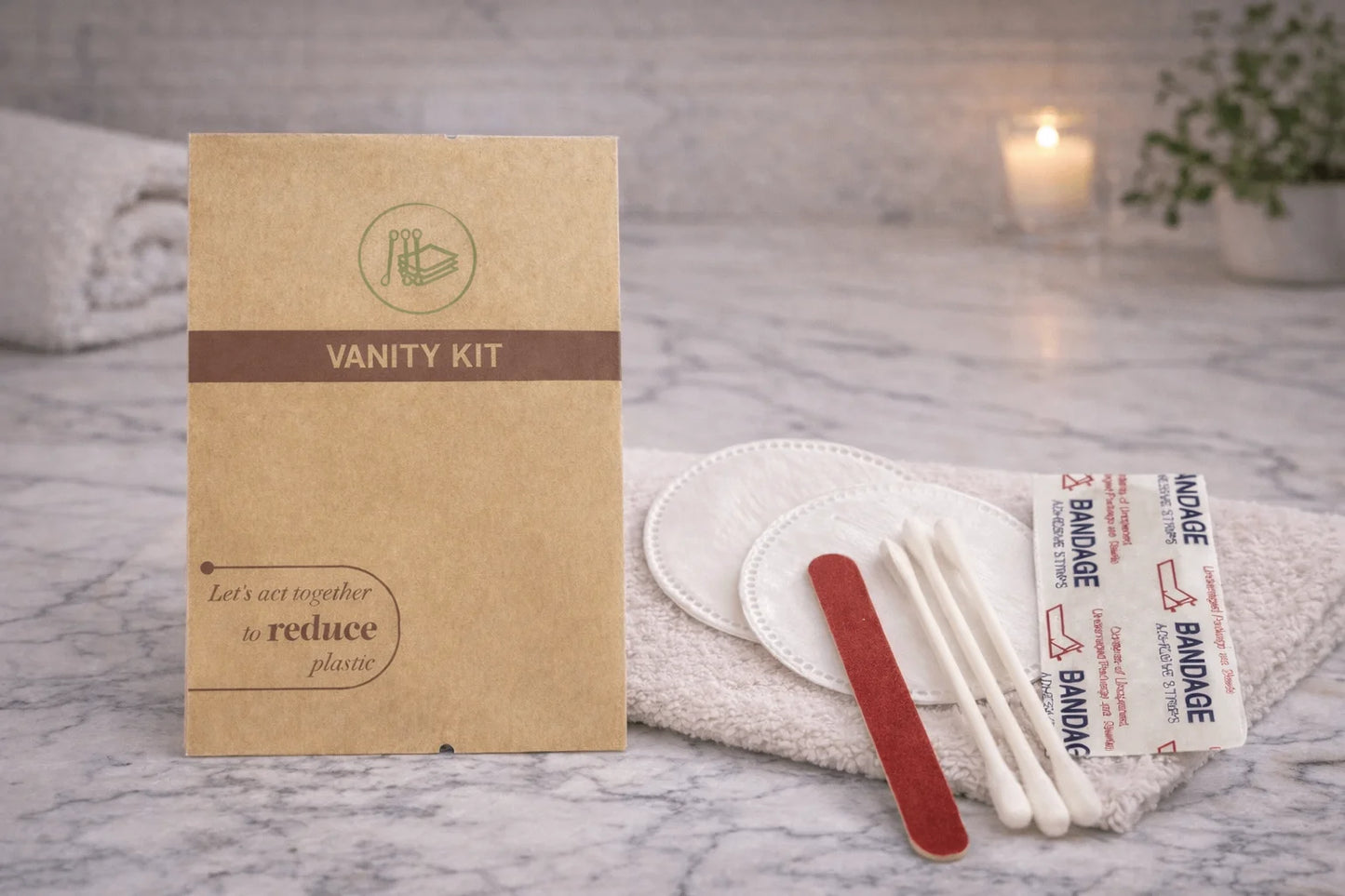 Vanity kit with bandages and a wooden stick on a marble surface
