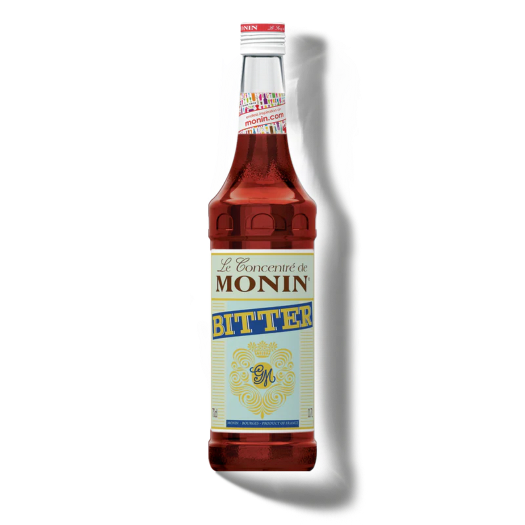 Monin Bitter syrup bottle on a white background