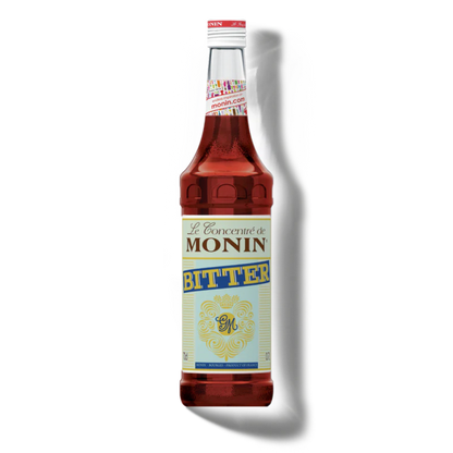Monin Bitter syrup bottle on a white background