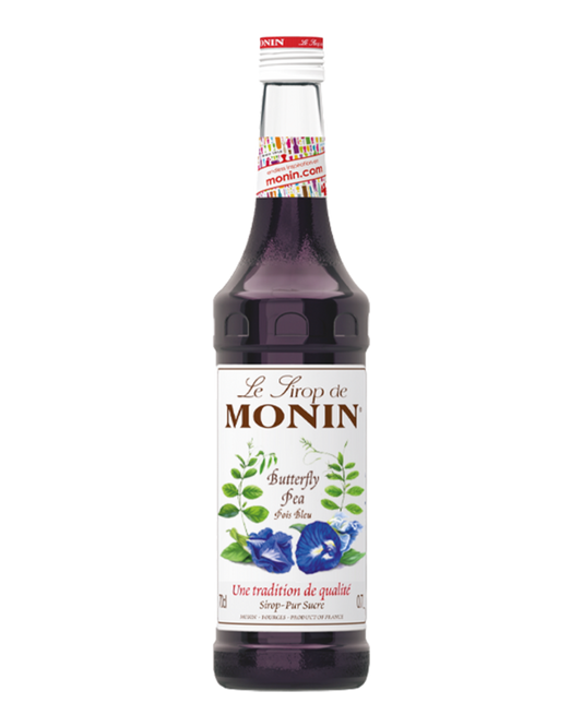 Monin butterfly pea syrup bottle on a white background