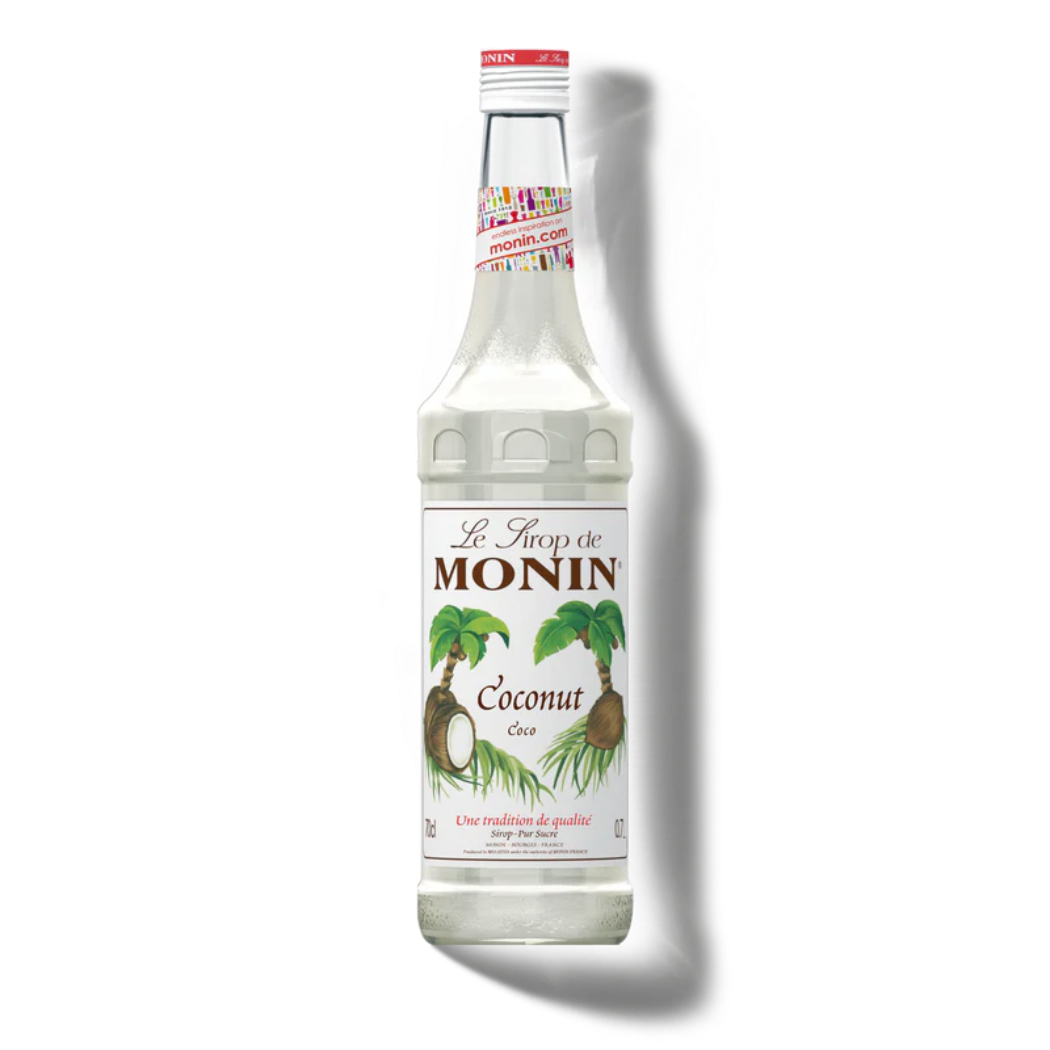 Monin coconut syrup bottle on a white background