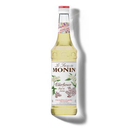 Monin Elderflower syrup bottle on a white background