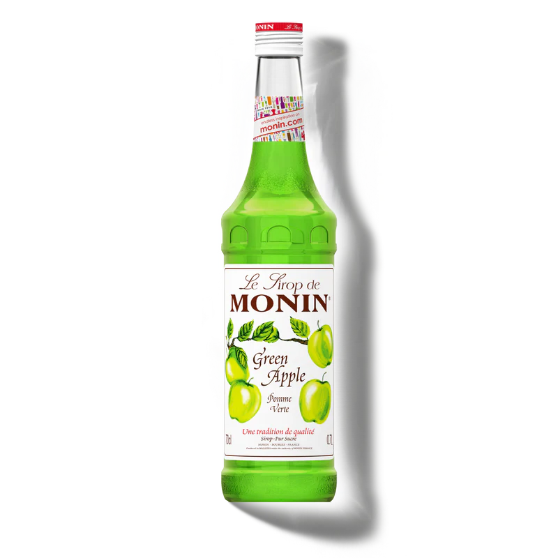 Green bottle of Monin Green Apple syrup on a white background