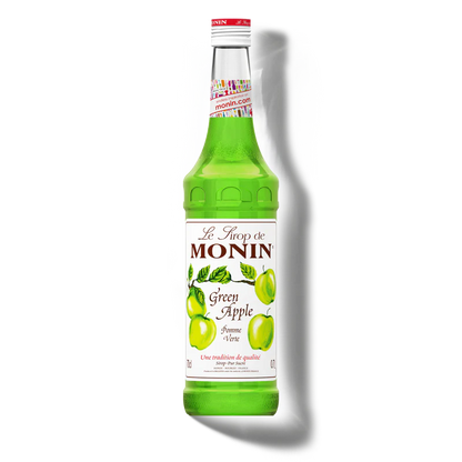 Green bottle of Monin Green Apple syrup on a white background