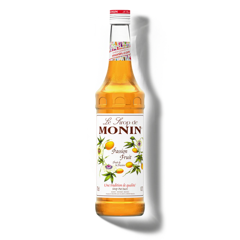 Monin passion fruit syrup bottle on a white background