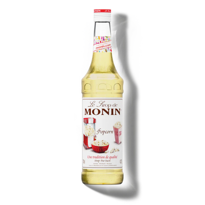 Monin popcorn syrup bottle on a white background