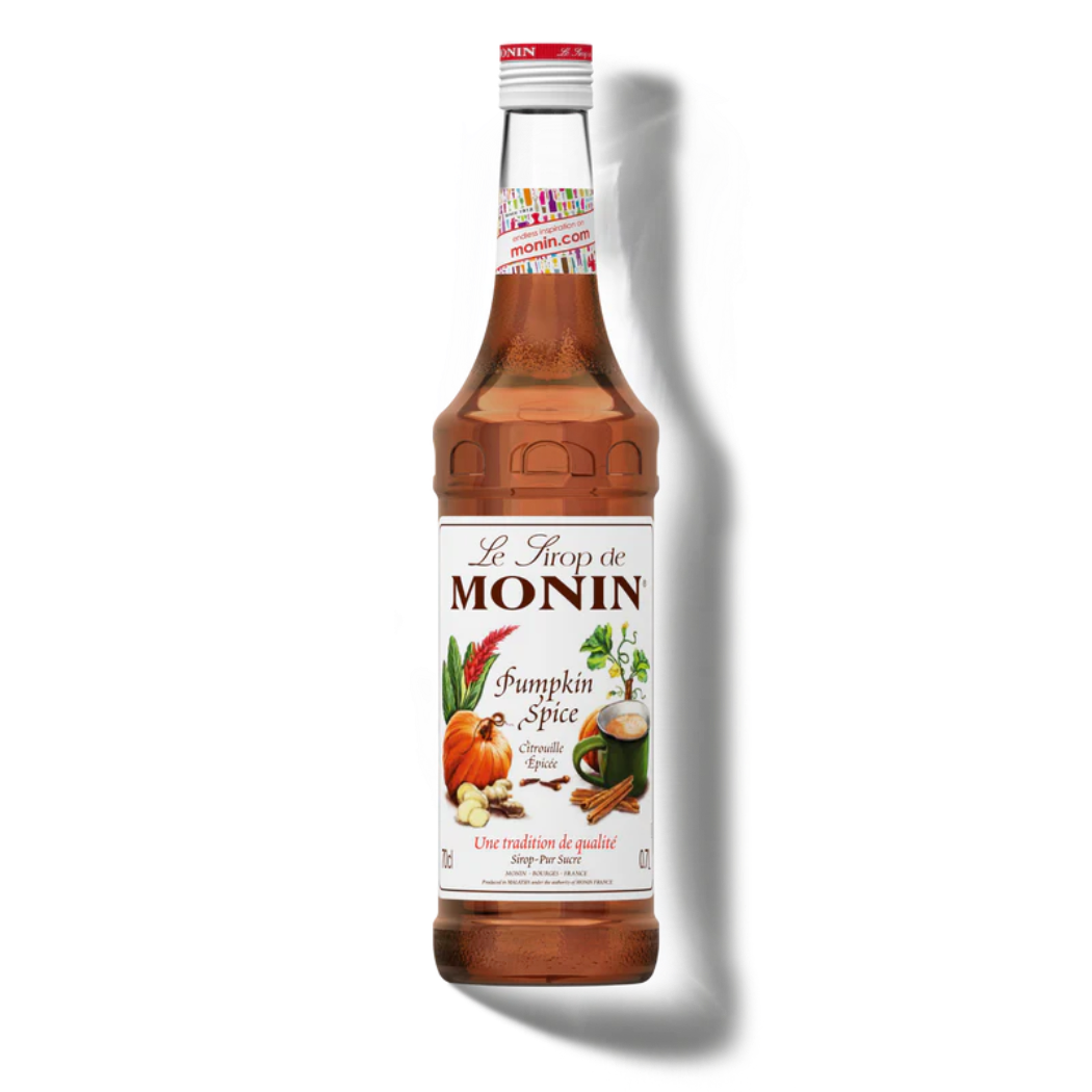 Monin Pumpkin Spice syrup bottle on a white background