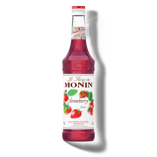 Bottle of Monin strawberry syrup on a white background
