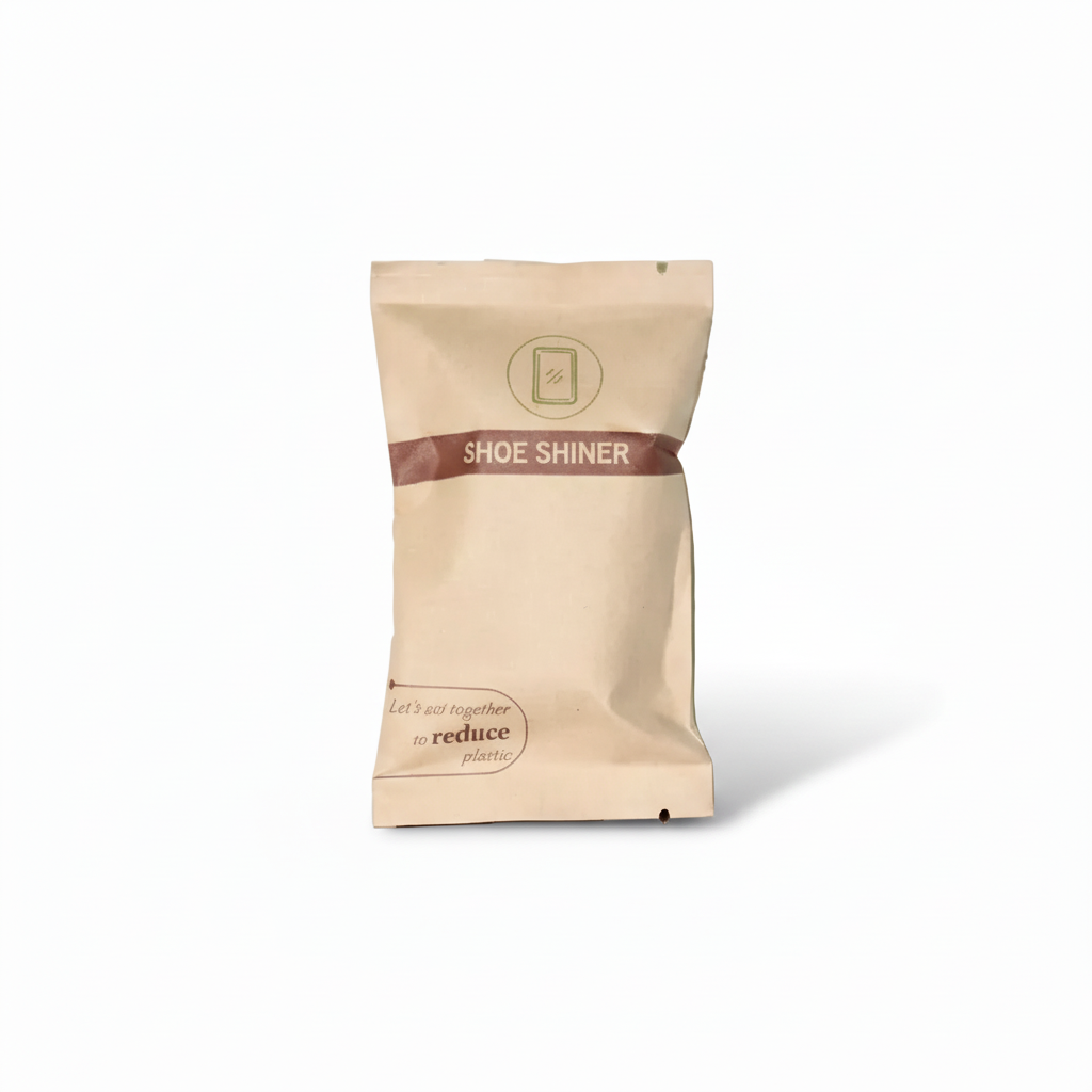 Beige shoe shiner packet with a brown band on a white background