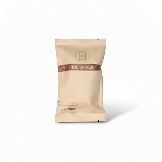 Beige shoe shiner packet with a brown band on a white background